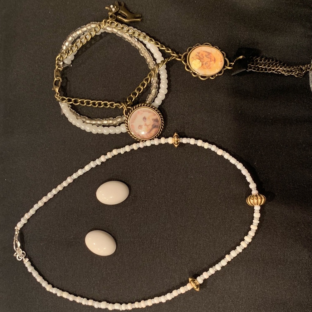 set with a necklace, earrings, and cat bracelets